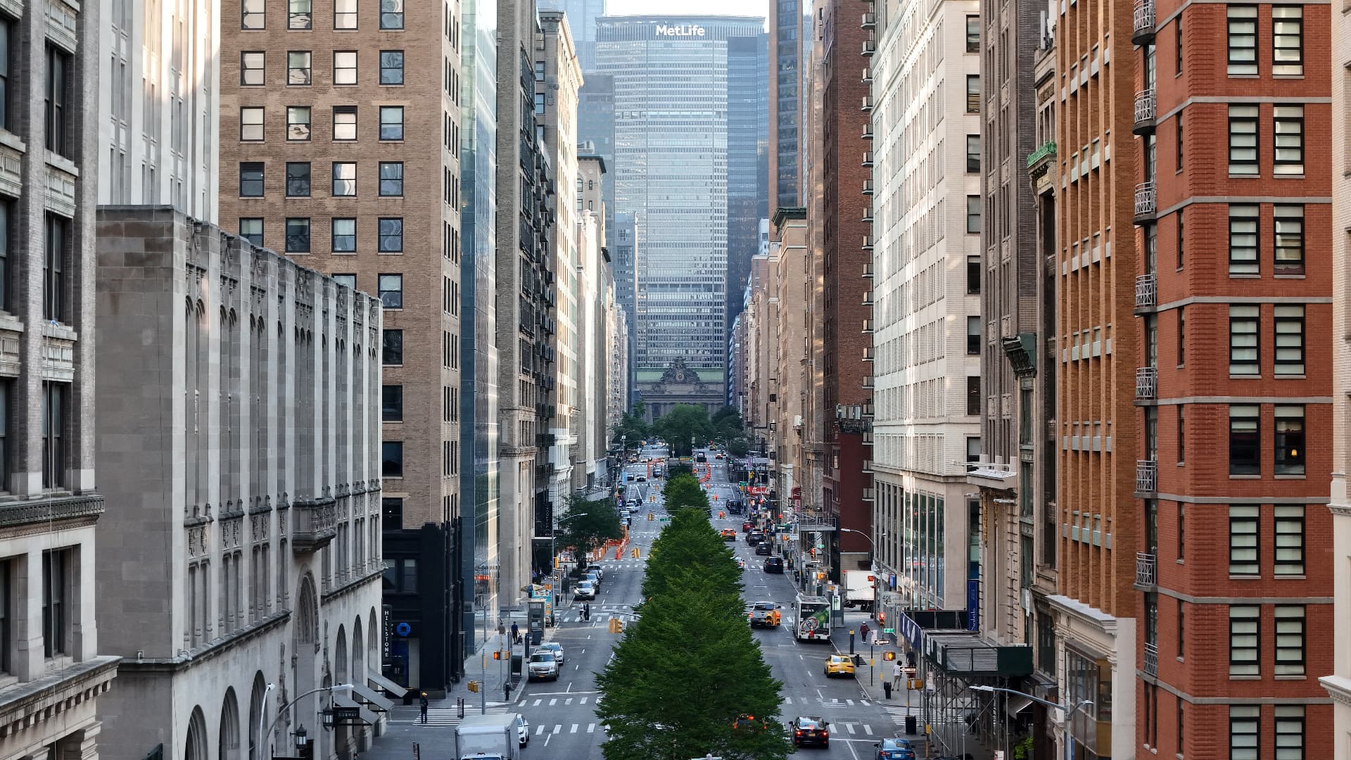 Aerial view of a Manhattan avenue with the MetLife building in the distance
